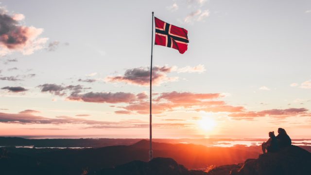 Norway flag standing on cliff